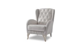 Κλασική πολυθρόνα με καπιτονέ πλάτη.